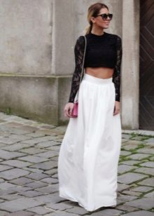 Long white half skirt in combination with a black top
