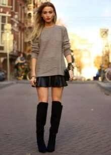 Leather skirt in sun with suede boots