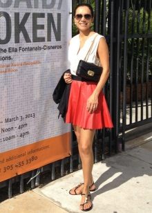 Red leather skirt in the sun with a sleeveless blouse