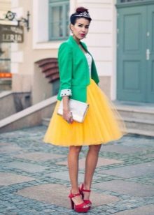 Layered yellow skirt in combination with a jacket