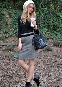Gray pencil skirt in combination with a black turtleneck and white beret