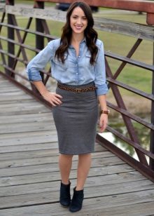 Gray pencil skirt in combination with a leather strap and denim shirt