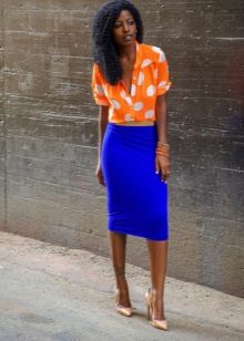Blue pencil skirt in combination with orange blouse