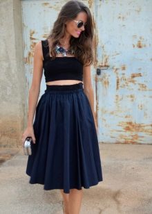 Fluffy skirt below the knee with a short tight top