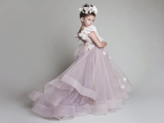 Elegant wedding fluffy dress with a train for the girl