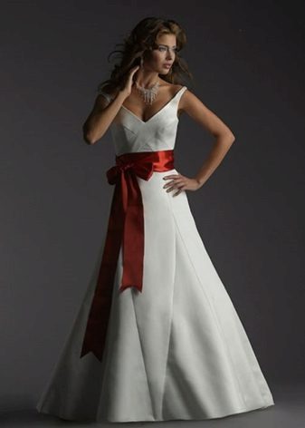 Wedding dress with a red bow in front