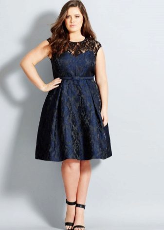 Dress medium length for full of dense material, hides the belly