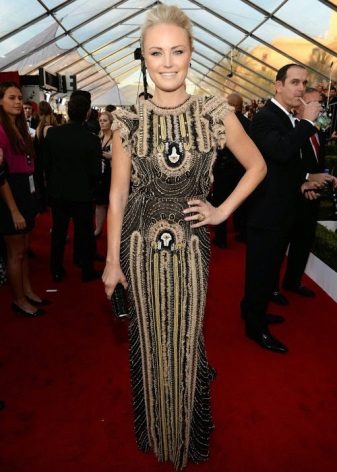 Dress of a direct silhouette with a print and embroideries