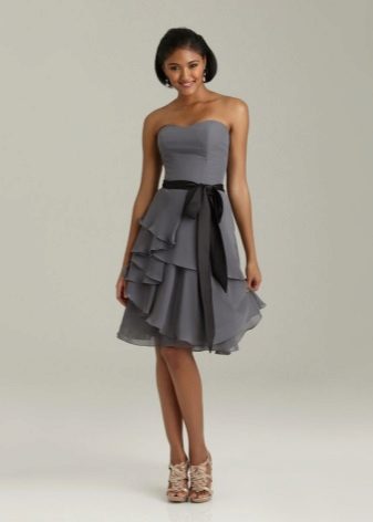 Dress with asymmetrically sewn ruffles on skirt