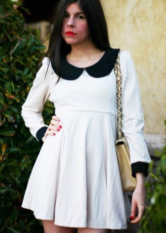 Knit white dress with a high waist with a black collar and cuffs