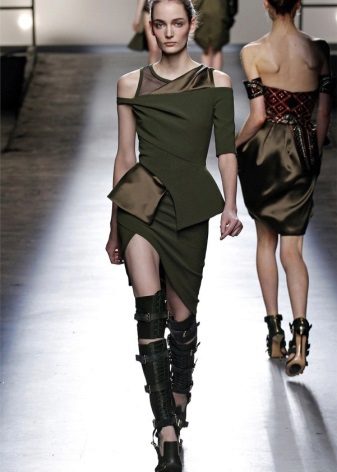 Asymmetrical military style dress with high boots on belts