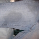 How to wash a greasy stain on jeans?