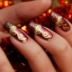 Red manicure with gold: royal luxury and chic