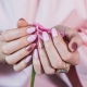 The subtleties of the selection of manicure under a pink dress