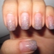 Manicure with sparkles on the tips of the nails