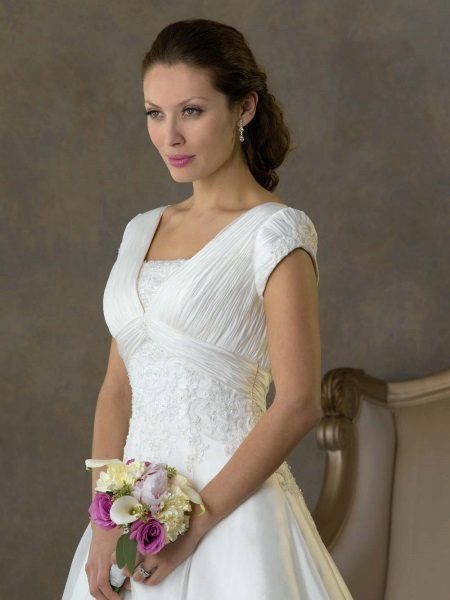 long wedding dress with an adjacent short sleeve