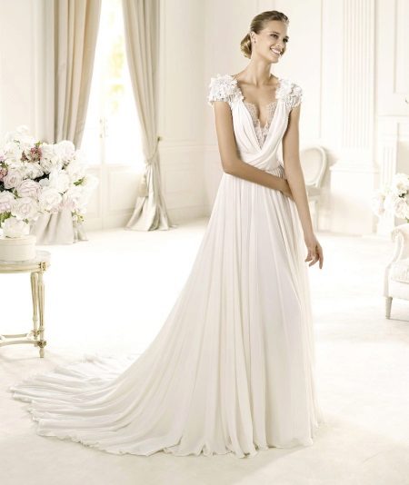 Wedding dress with a deep neckline and short sleeves
