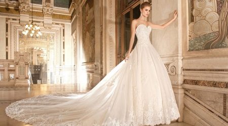 Wedding magnificent dress with the closed openwork top and a loop