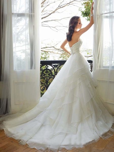 Wedding magnificent dress with a loop multilayered