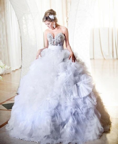 Wedding dress with a fluffy skirt and flowers