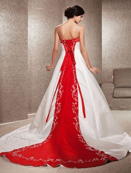 Wedding dress with a red element on the back