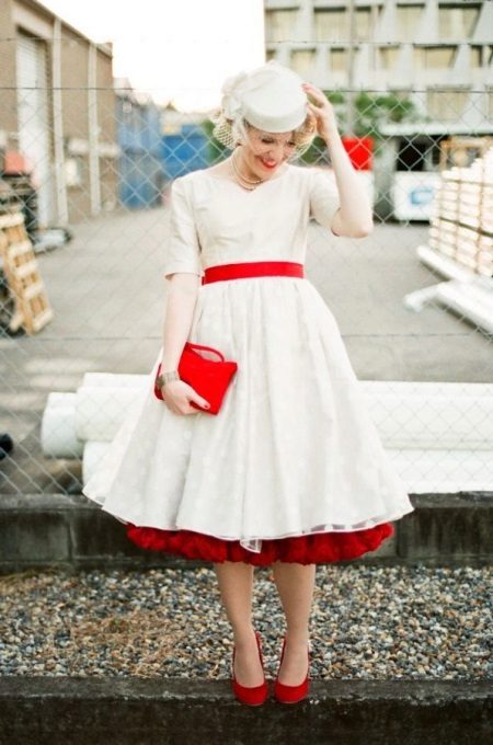 Wedding dress in the style of style with red accessories