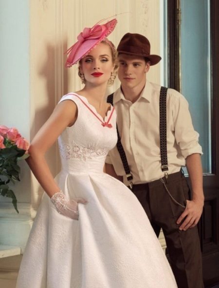 Wedding dress in retro style combined with the suit of the groom