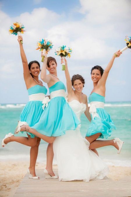 Turquoise bridesmaid dresses on the beach