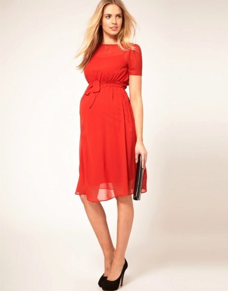 Red maternity dress with black shoes