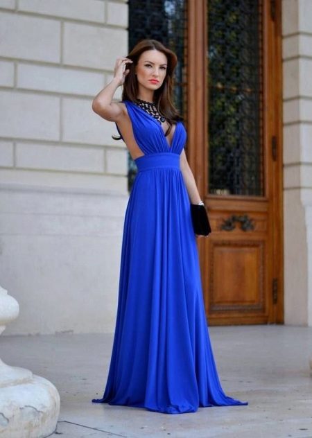 Bright blue long dress in the floor