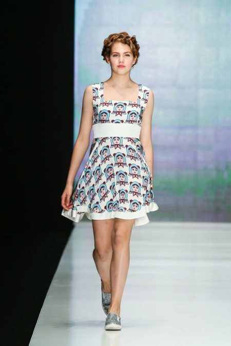 The dress is a short color dress