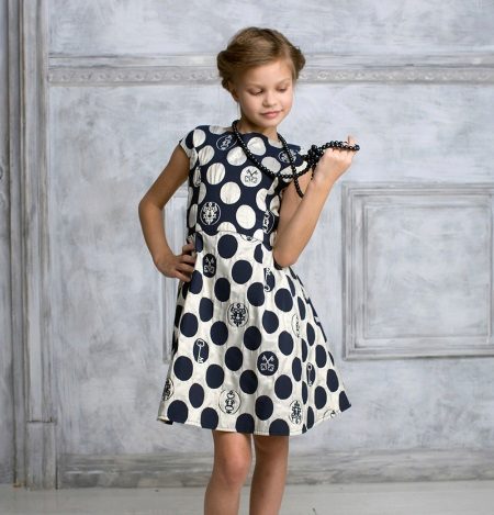 Cocktail dress for a girl in polka dots