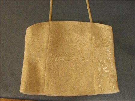 Ready to corset on the dress for the girl